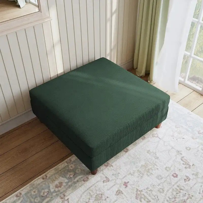 Ottoman moderno rivestito in velluto a coste con gambe in legno