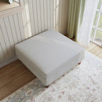 Ottoman moderno rivestito in velluto a coste con gambe in legno