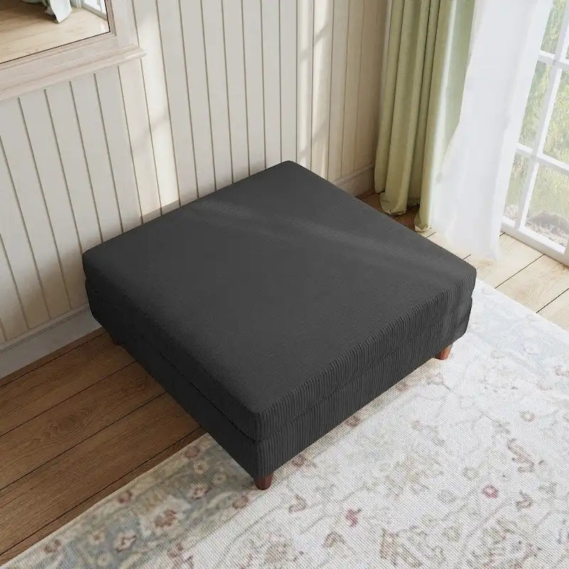 Ottoman moderno rivestito in velluto a coste con gambe in legno